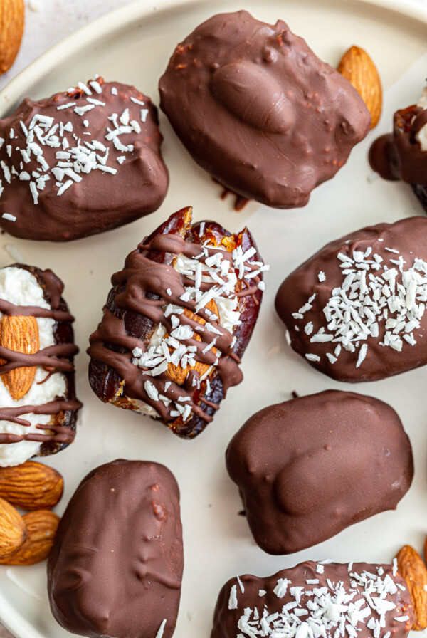 medjool dates stuffed with coconut and topped with an almond and meted chocolate