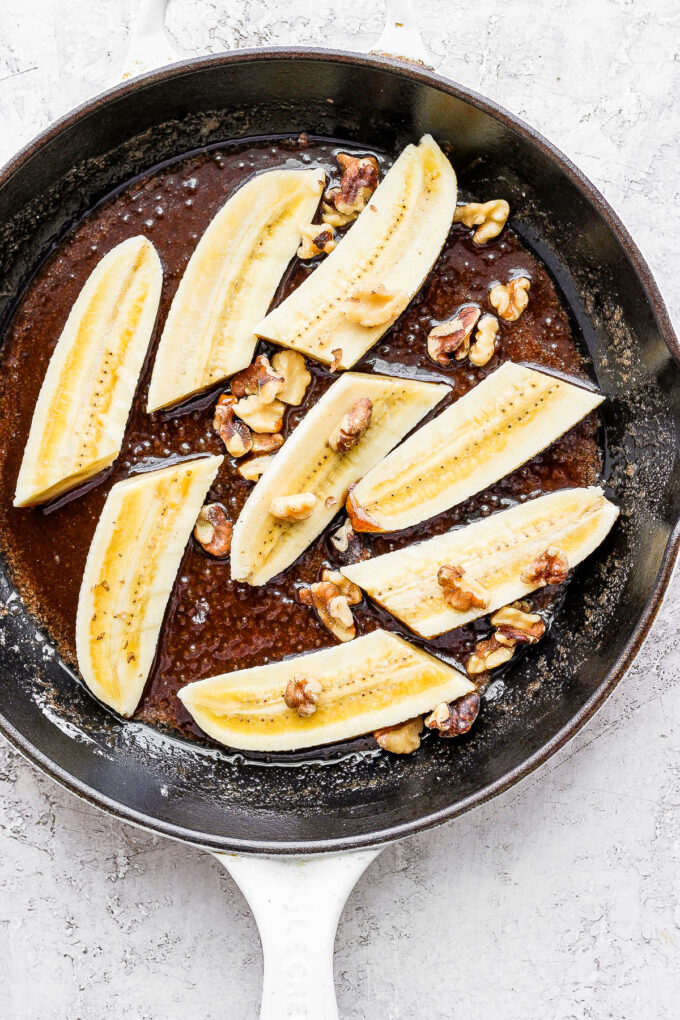 sliced bananas cooking in a skillet