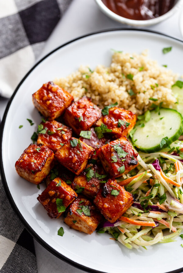 bbq tofu in a bowl with quinoa and coleslaw