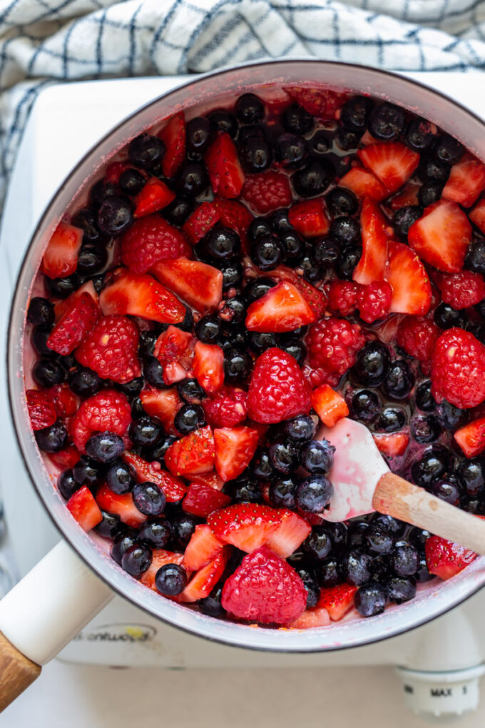 mixed berries cooking in a pot