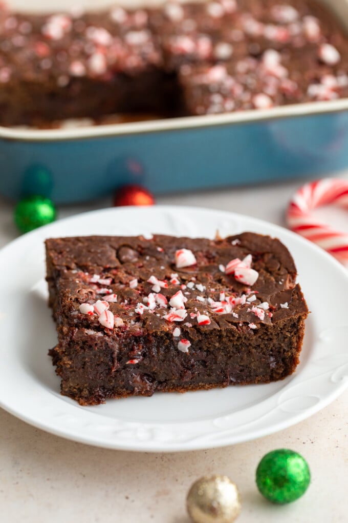 chocolate peppermint baked oats topped with crushed peppermint on a white plate