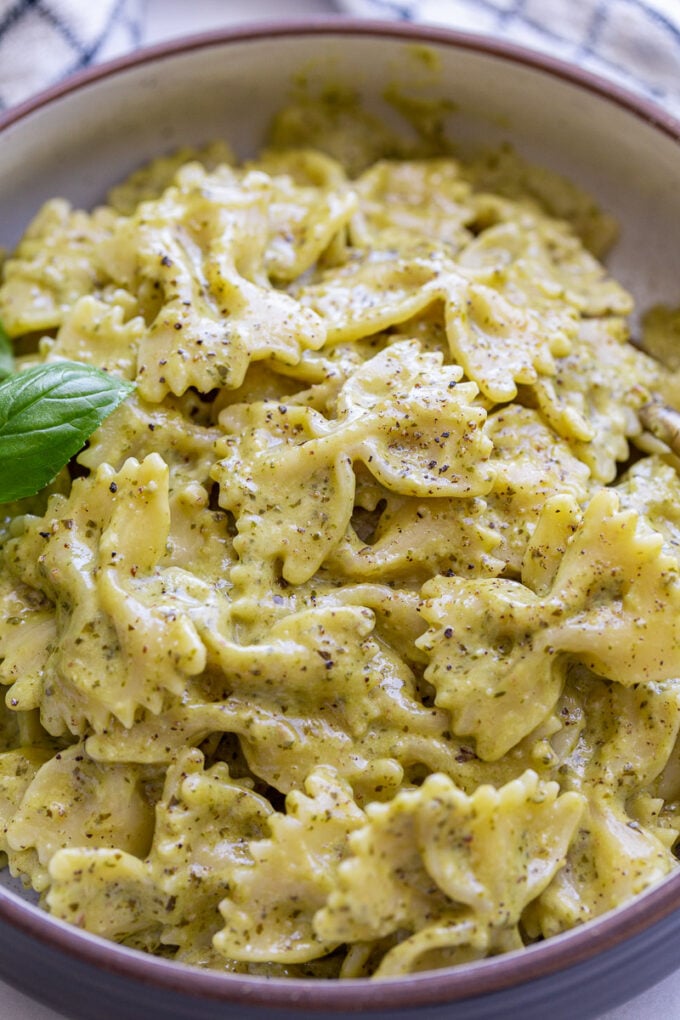 Bowtie pasta with pesto sauce.