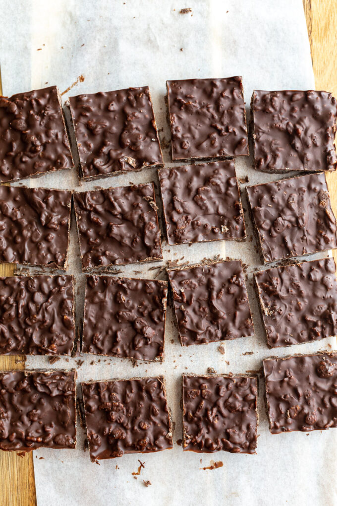 crunch bars cut into 12 squares and arranged on a piece of white parchment paper