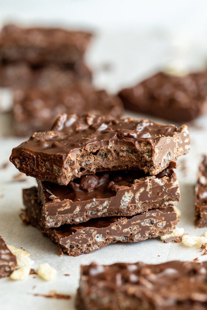 3 crunch bars stacked on top of each other with the top one having a bite taken out