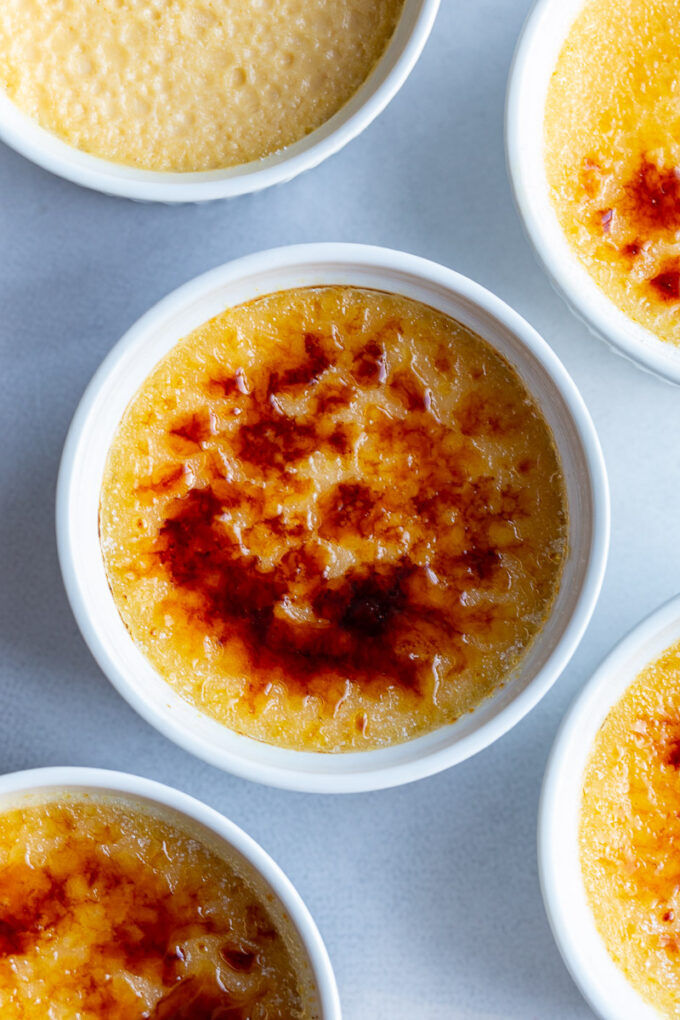 Crème Brûlée served in a white ramekin.