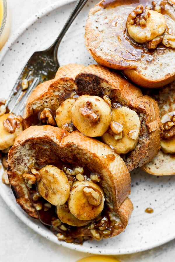 Bananas Foster French Toast served on a white plate.