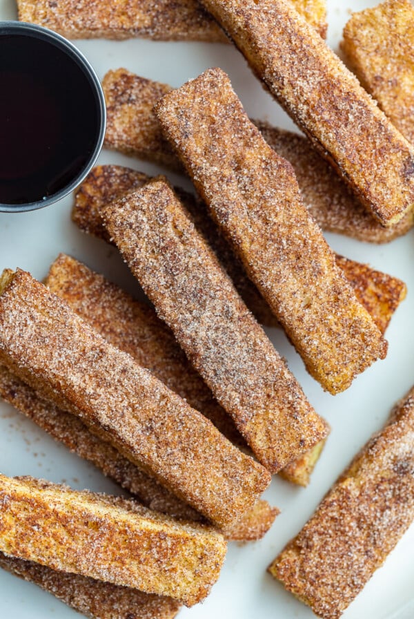 French toast sticks served with maple syrup.