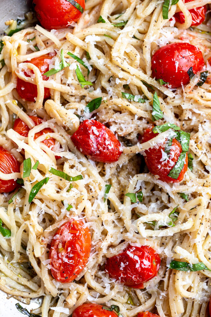 Hearts of palm pasta topped with parmesan cheese and cherry tomatoes.