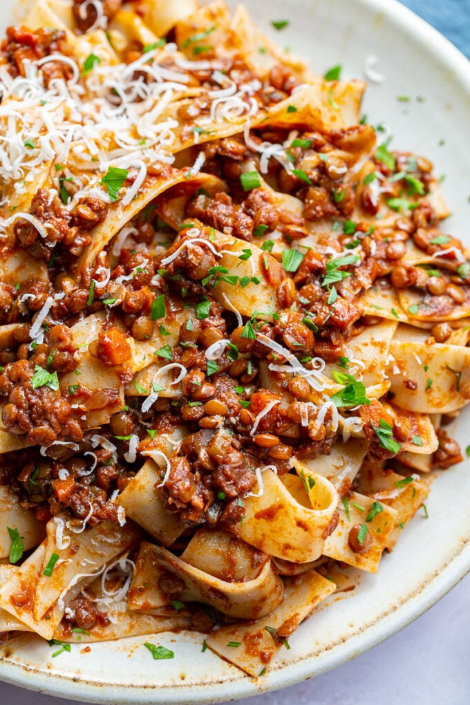 Saucy pasta garnished with fresh parsley.