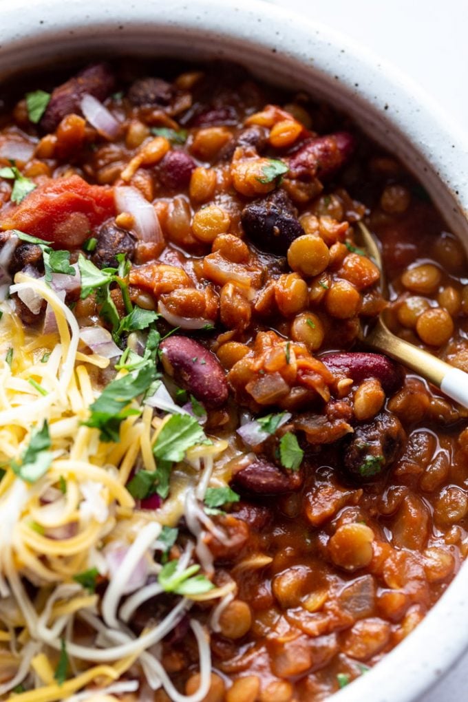 vegetarian chili served in a bowl with a spoon