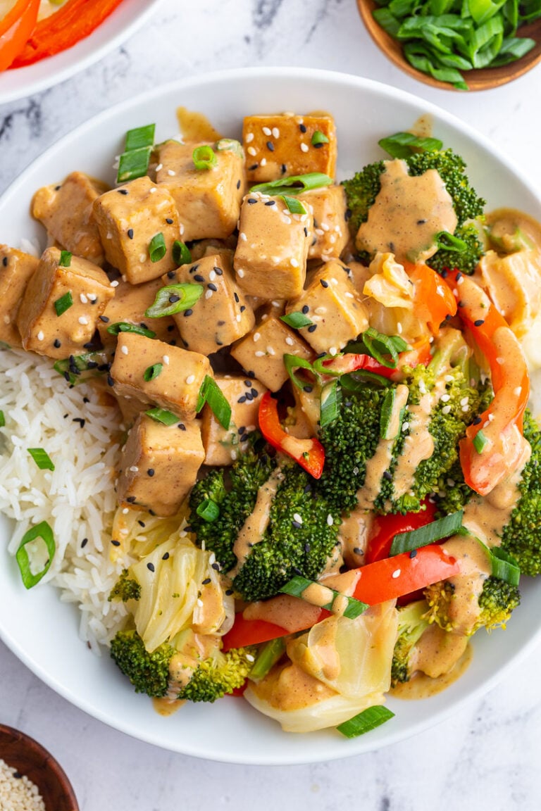 Peanut sauce tofu served with broccoli over rice.