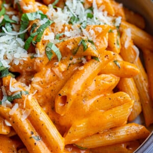 Red pepper pasta in a bowl.