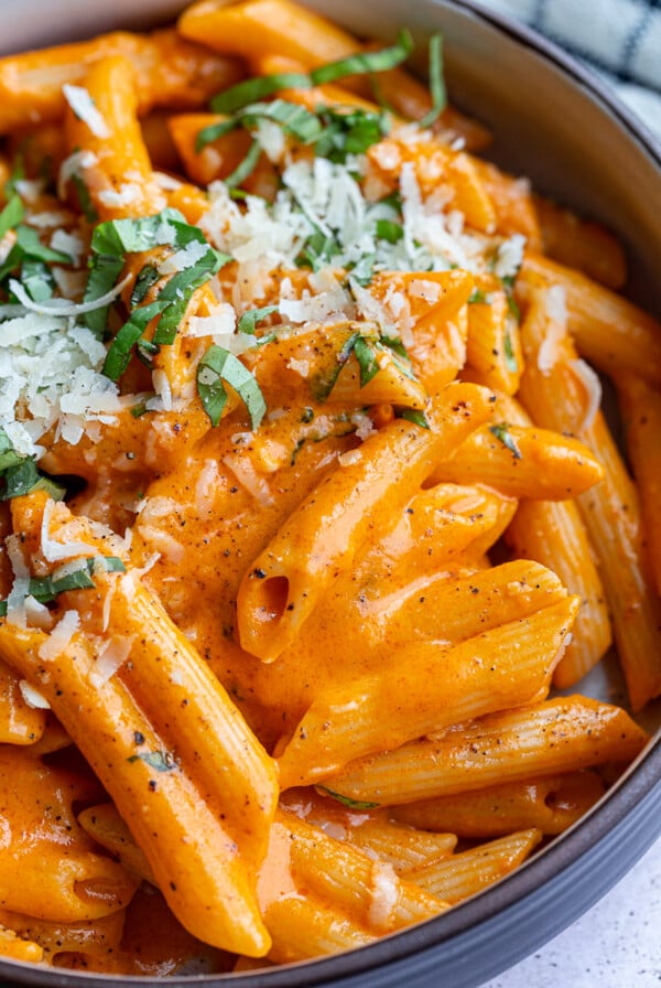 Red pepper pasta in a bowl.