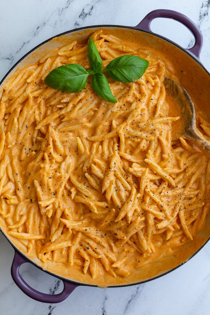 Spiral pasta in a roasted red pepper sauce. all in a large skillet