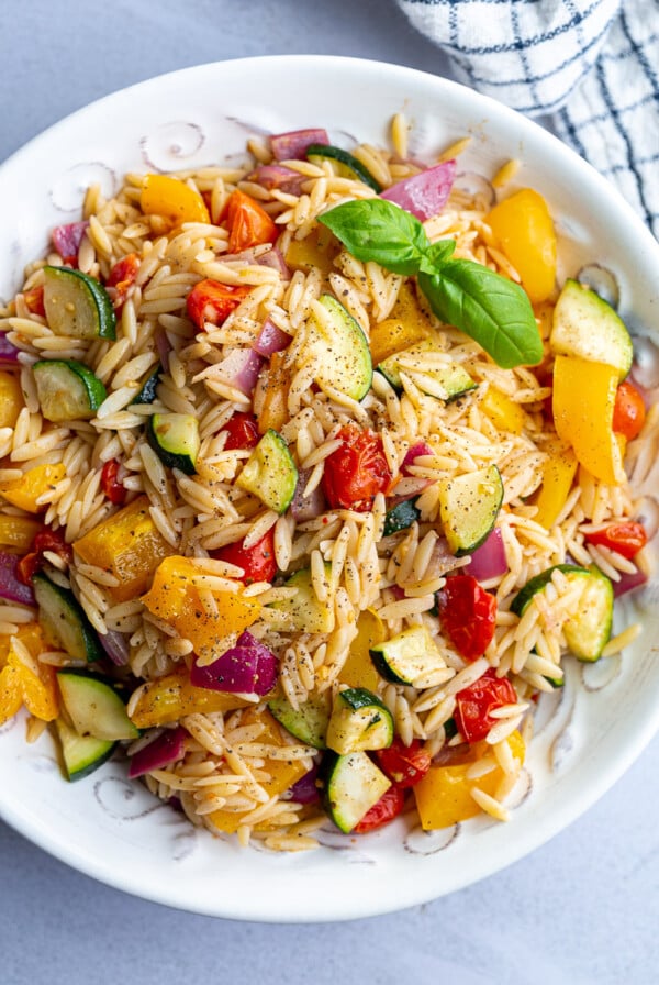 Orzo pasta salad with roasted veggies mixed in.