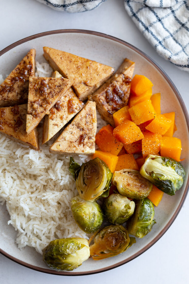 tofu and veggies over rice in a bowl