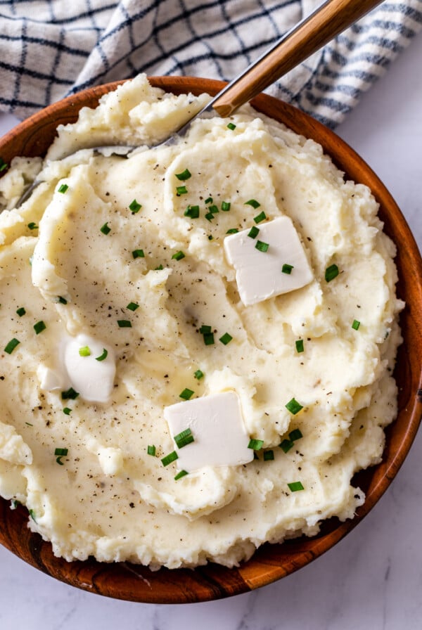 mashed potatoes topped with pats of butter