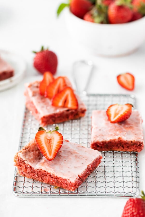 strawberry blondies on a wire cooling rack