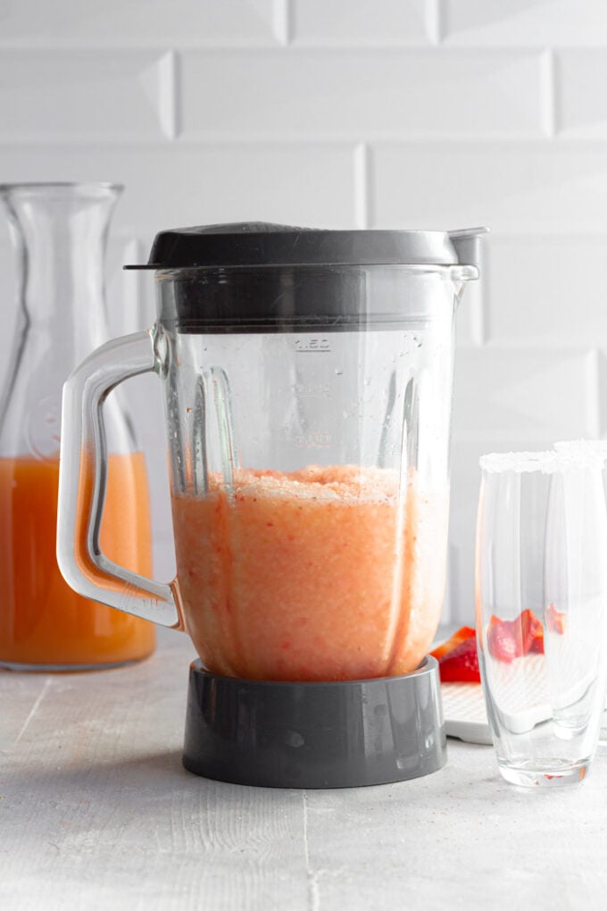 blender filled with a frozen pink drink