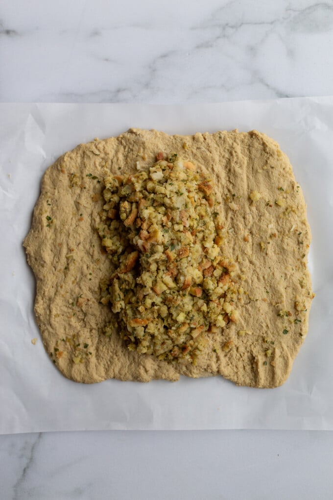 how to make a seitan roast: seitan rolled out with stuffing in the center