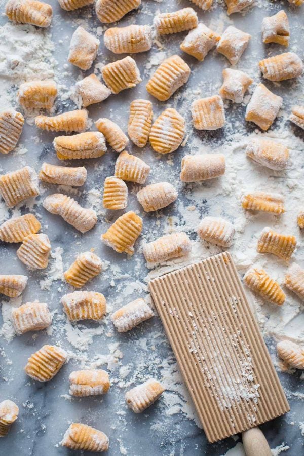 flour and sweet potato gnocchi on a marble board