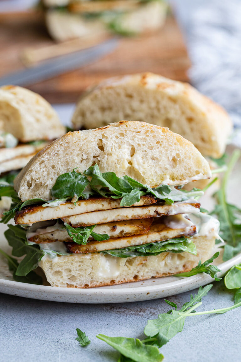 Tofu sandwich on a plate.