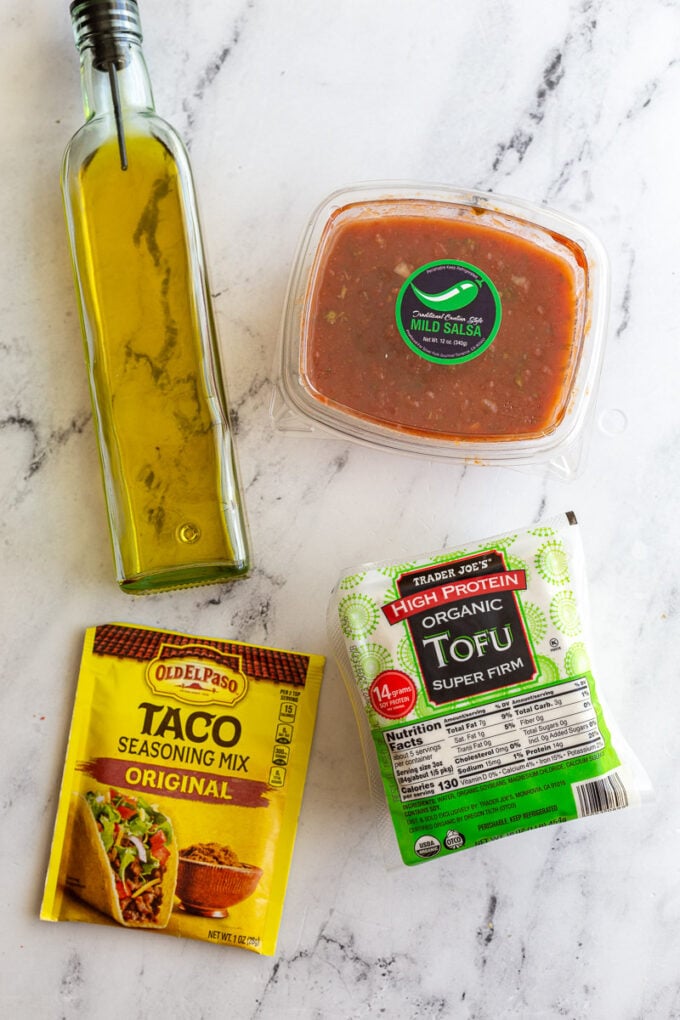 ingredients to make tofu tacos: tofu, oil, salsa, and taco seasoning