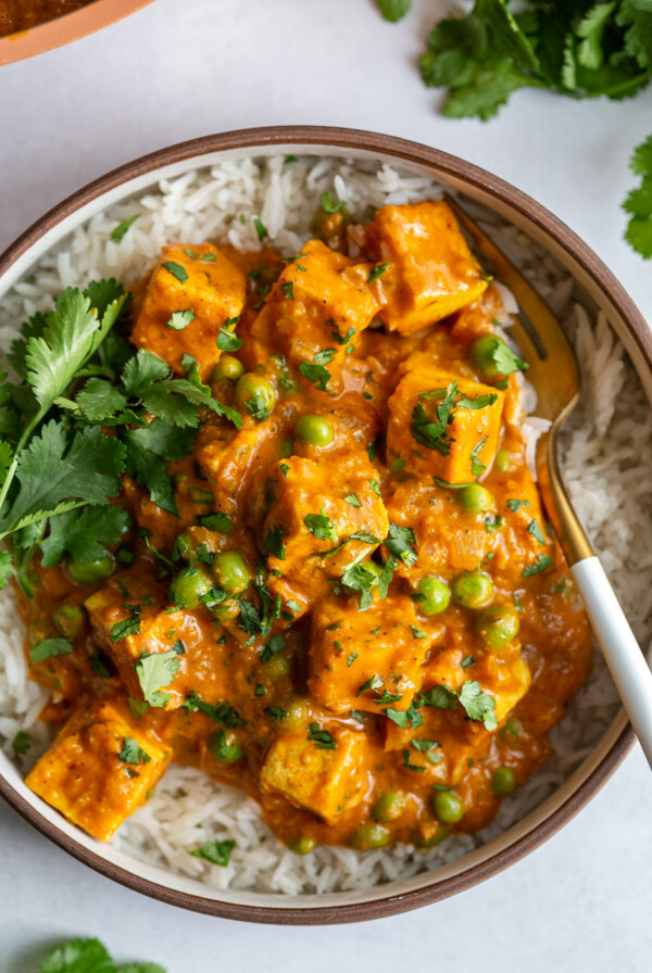 tofu tikka masala in a large bowl with fresh cilantro on top