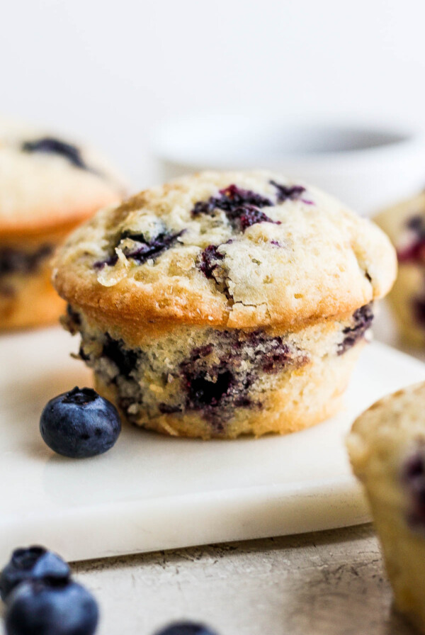 Vegan Blueberry Muffins on a white tray.