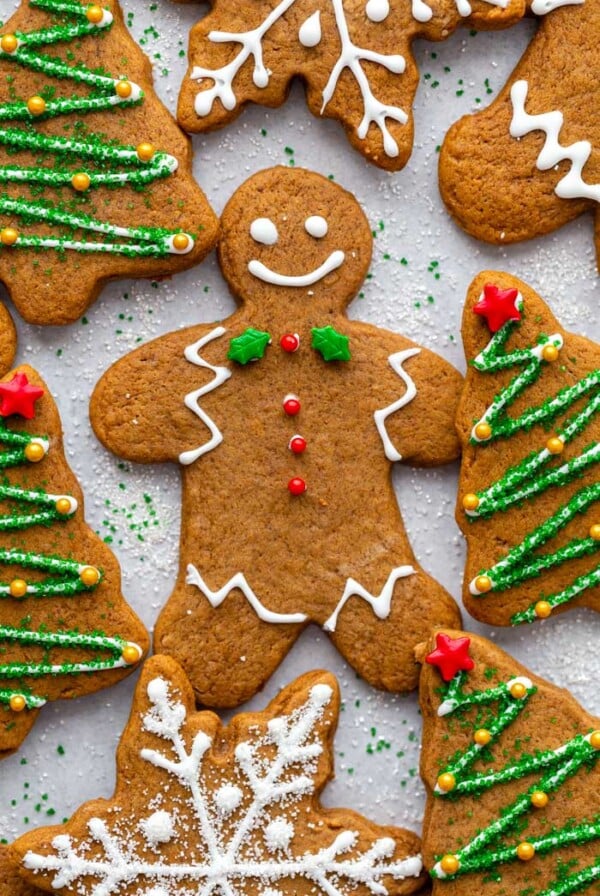 gingerbread cookies cut into shapes and decorated with icing