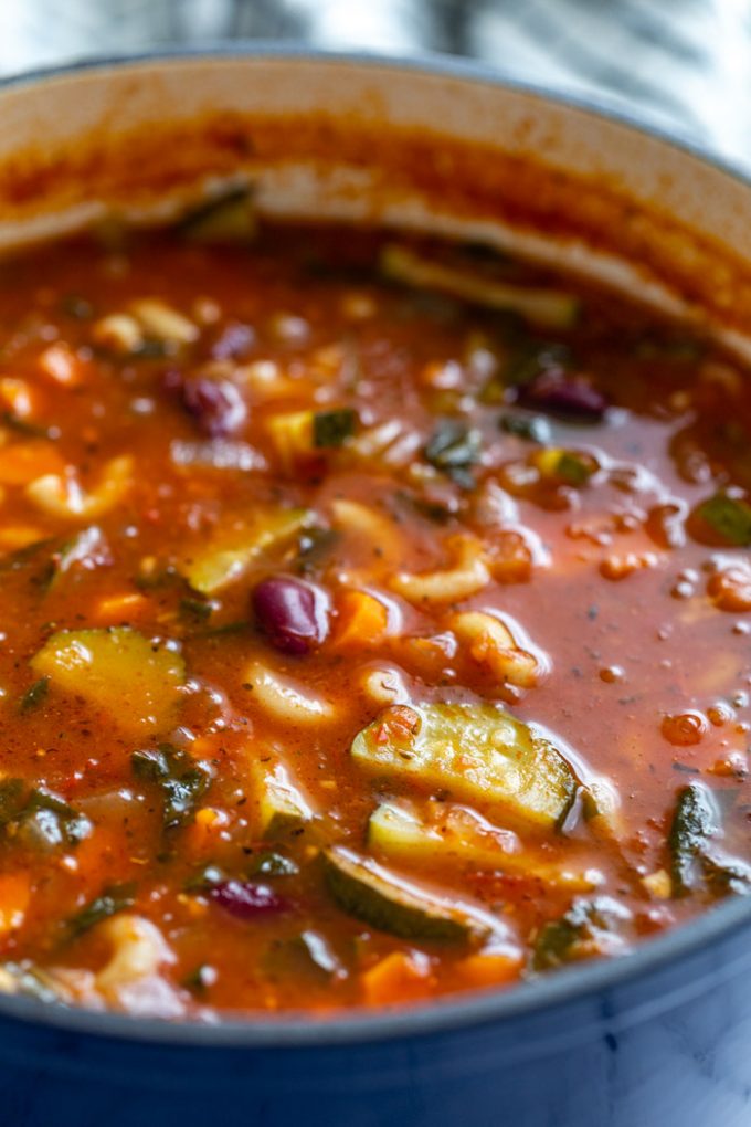 side shot of vegan minestrone soup in a large pot