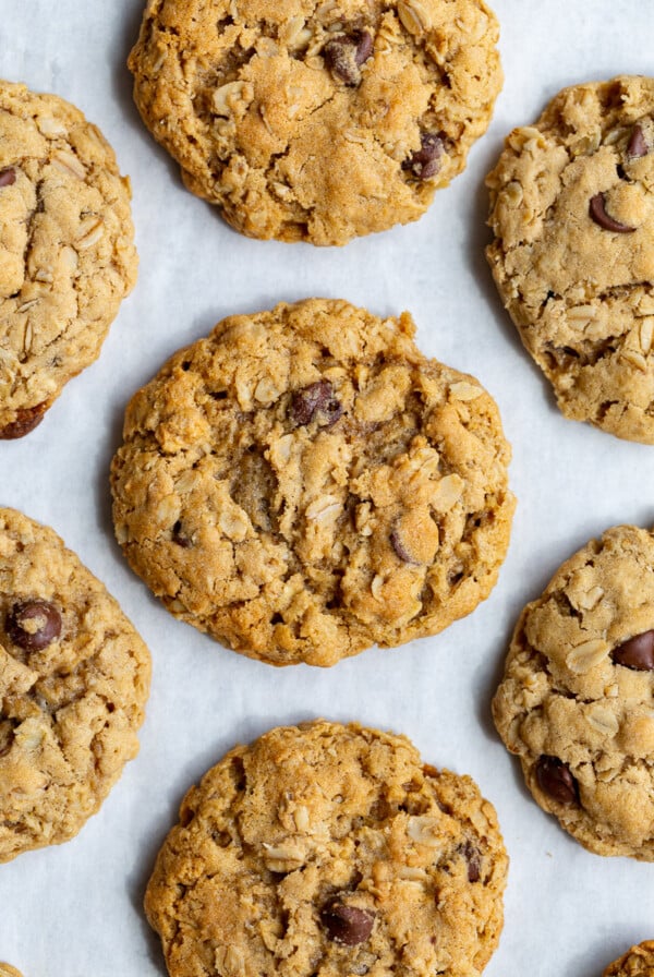 vegan oatmeal cookies lined up on a baking tray