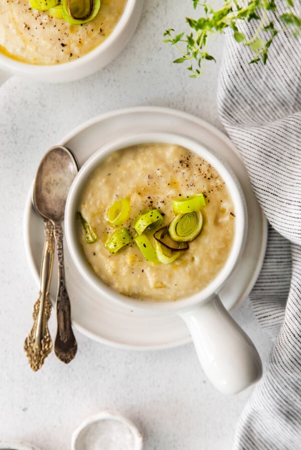 Vegan Potato Leek Soup in a small white soup bowl