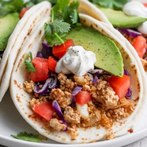 tortilla filled with vegan taco meat and fresh veggies