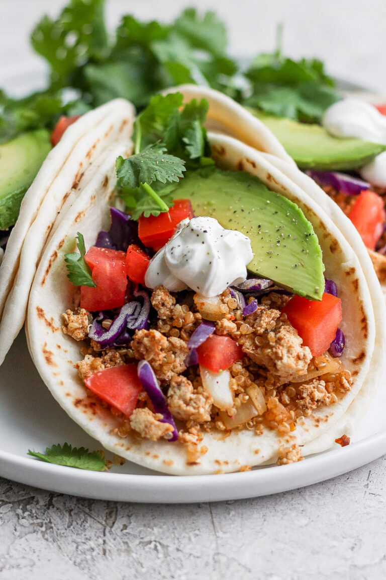 tortilla filled with vegan taco meat and fresh veggies