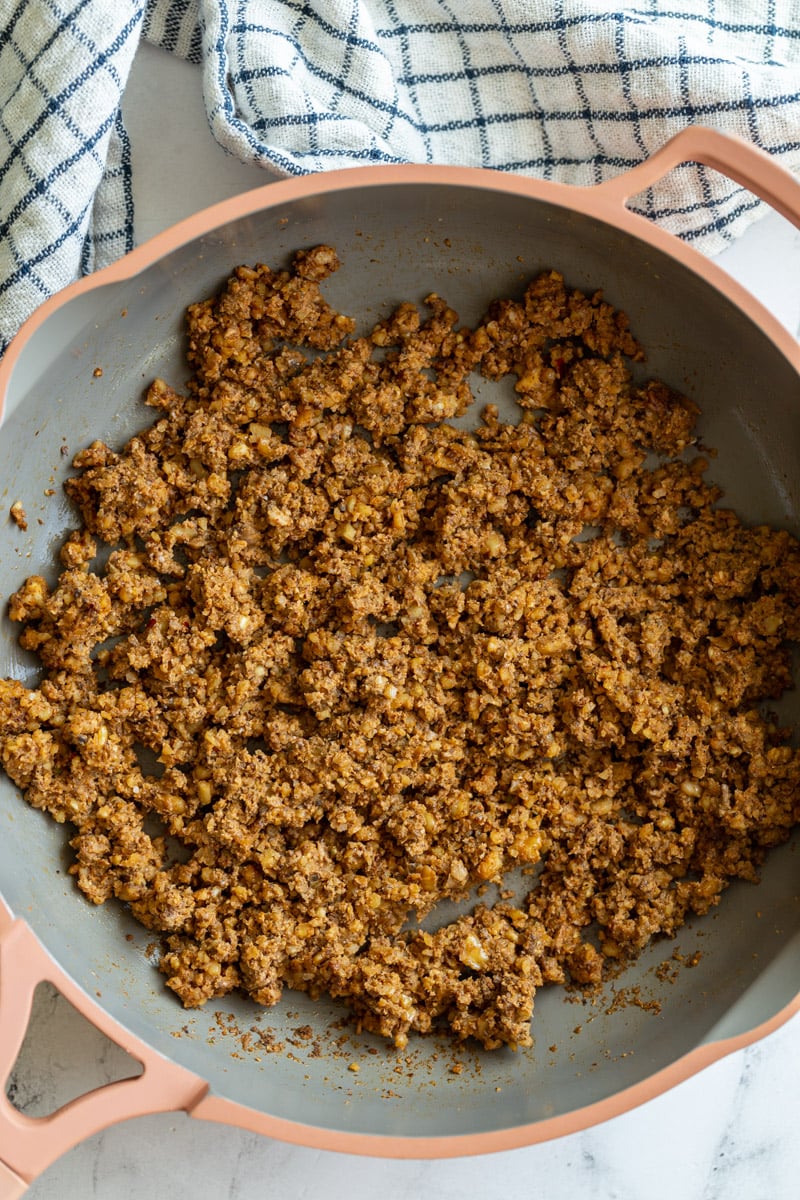 mushroom and walnut taco meat in a pink skillet